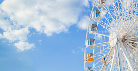Ferris Wheel round carnival carousel object vivid sky background panoramic space advertising concept picture with place for your text hereの写真素材