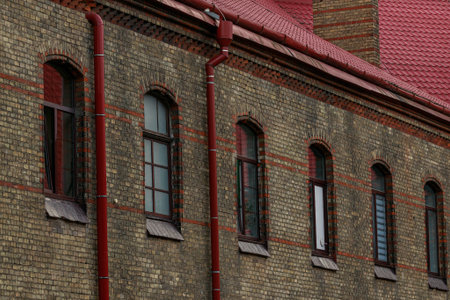 medieval residence facade perspective wall dark brick and arch windows architecture background viewの写真素材