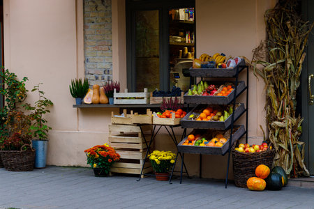 market square product shop retail shelfs with fruits and vegetables raw fresh food on a counter along street European aesthetic conceptの写真素材