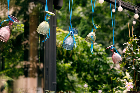 decorative design elements hanging before window background smooth surface opposite street natural reflectionの写真素材