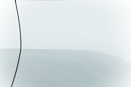 white metallic smooth surface pattern background concept with reflection on materialの写真素材