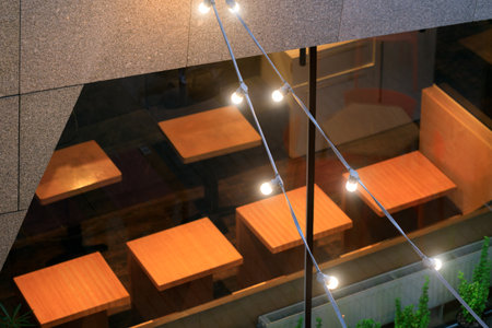 interior cafe cozy warm garland light external decorative urban design style view low key...