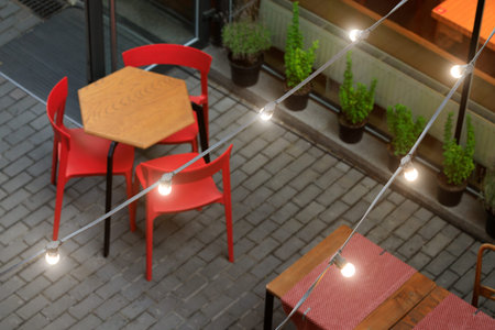 exterior cafe festive atmosphere urban street space top view with sitting places and light