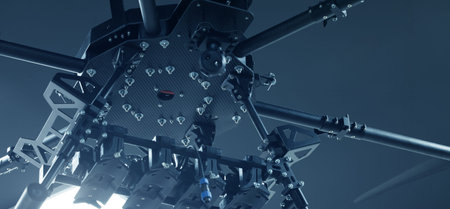 Detailed shot of a robust drone chassis constructed from metal and carbon fiber, designed for...