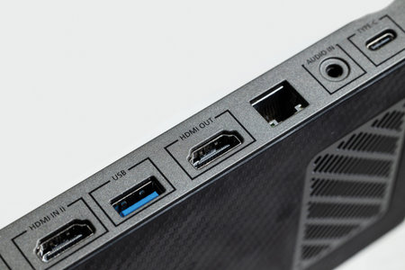 Explore the HDMI and USB ports on this sleek device showcasing connectivity options