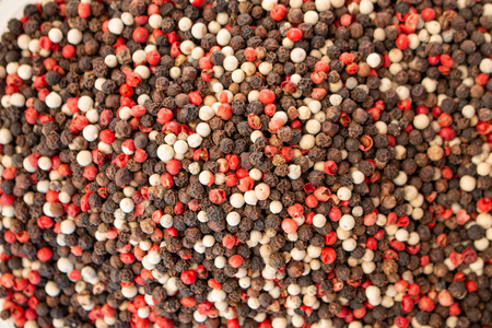 Texture of spices mix close-up, spice or seasoning as background. Black Pepper, Red pepper and White...