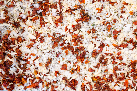 Texture of spices, herbs mix and sea salt close-up, spice or seasoning as background. Dried tomato, Sea salt, Pepper flakes, Chilli pepper.の写真素材