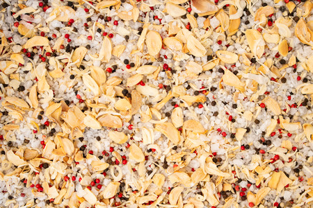 Texture of spices mix and sea salt close-up, spice or seasoning as background. Black Pepper, Red pepper, Garlic, Onion, Sea salt, Pepper flakes.の写真素材
