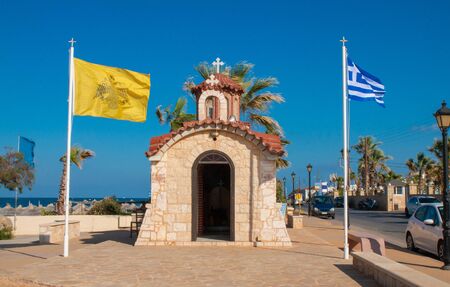 Church of Agios Dimitrios, Analipsi, Crete, Greece.  Analipsi beach with palms and Church Saint Dimitrios. の写真素材