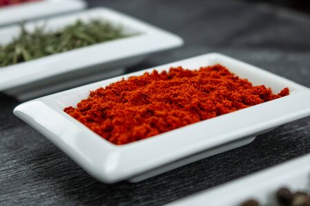 Paprika powder. Colorful spices in white bowls Seasonings for cooking. Natural Herbs & Spices.の写真素材