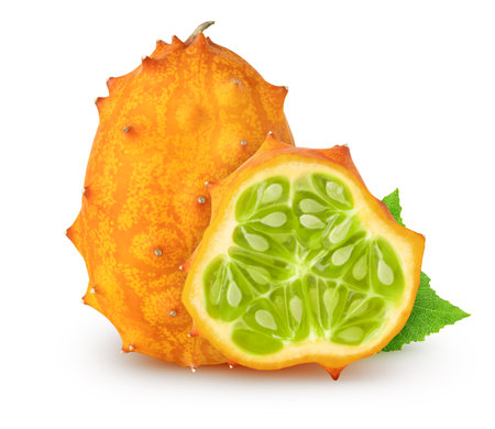 Isolated kiwanos. Whole kiwano melon fruit and slice with leaves isolated on white background with clipping pathの写真素材