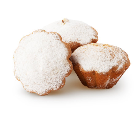 Three delicious muffins with raisin and powdered sugar isolated on white background with clipping pathの写真素材