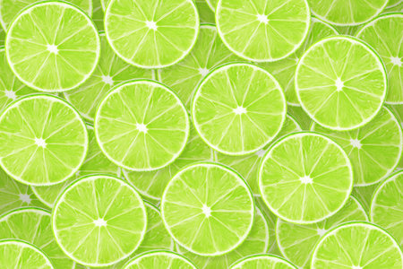 Background of lime sliced piecesの写真素材