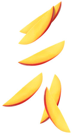 Isolated flying mango slices. Falling mango fruit isolated on white background with clipping pathの写真素材