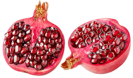 Isolated pomegranate. Cut red fleshed pomegranate fruit isolated on white background with clipping...