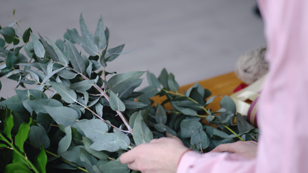 Florist chooses a branch for a wedding bouquetの写真素材