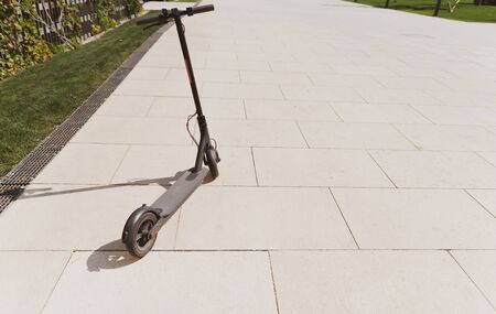 Mode of eco mobile transport. Electric scooter in the park, wide angleの写真素材