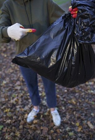 Helping nature - clearing the forest of debris left by peopleの写真素材