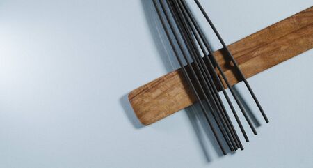 Sticks incense on a light background isolated banner. Natural aromatherapyの写真素材