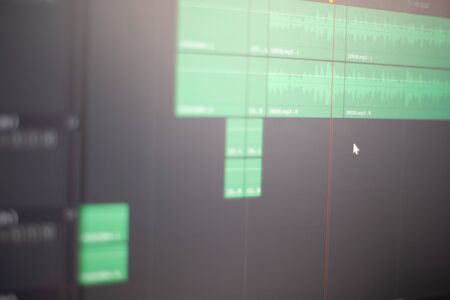 Audio edit in the recording studio, a close-up screen. Music editing in a computer application, sound control and correction, professional editing at work.の写真素材