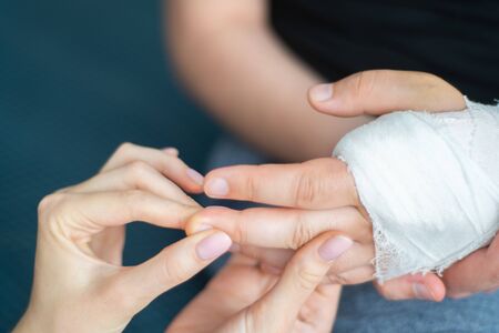 Patient with a broken arm. Diagnosis at a doctors consultationの写真素材