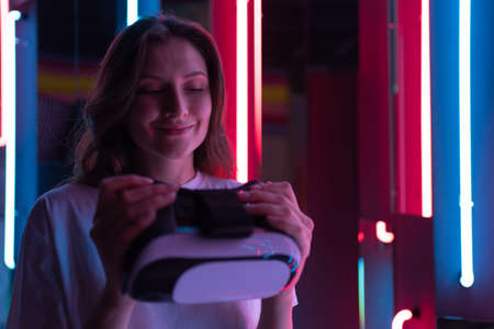 Cyber headset. Virtual reality technology. Person in the Neon