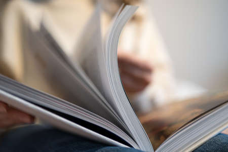 Turn the pages. Literature. Reading and studying a book, close-upの写真素材
