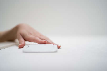 The light switch. The person turns on the light. Press the buttonの写真素材