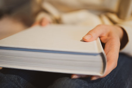 Pages of the white book. Reading literature in the libraryの写真素材