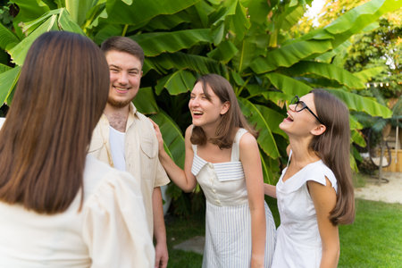 Friendship. Meeting friends in the open air. Communication and smilesの写真素材