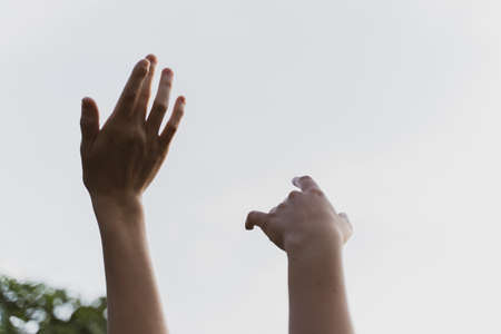 Hands of dancing friends at a party, close-up. Music Festival at Sunset