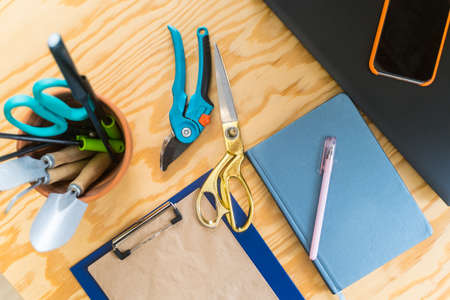 Florist tools and instruments. Close-up - counter in a flower shop. Workstation with scissors,...