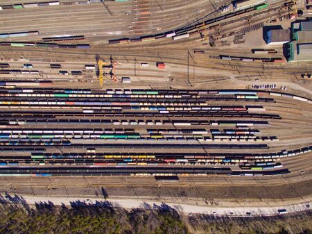 Aerial view of cargo trains. Railway wagons with goods on railroad.の写真素材