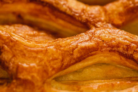 fresh strudel with apples and  raisins close-up