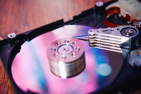Internal hard disk  closeup on wooden background