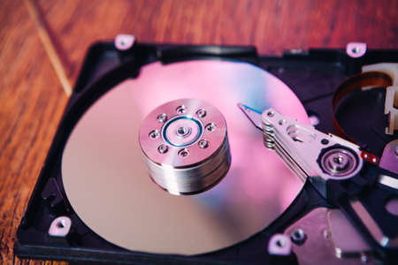 Internal hard disk  closeup on wooden background