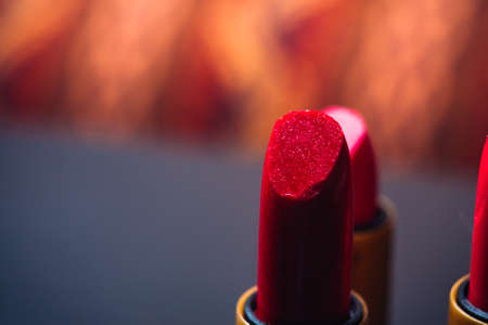 some red lipstick on a dark  backgroundの写真素材