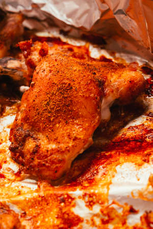 slices of fresh fried chicken with spices on plateの写真素材
