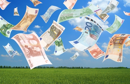 Falling euros (field background)の写真素材