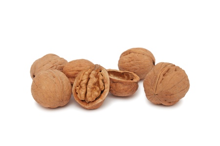Some walnuts (full and cracked) isolated on white background