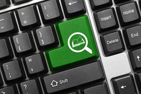 Close-up view on conceptual keyboard - Search (green key with loupe and book symbols)の写真素材