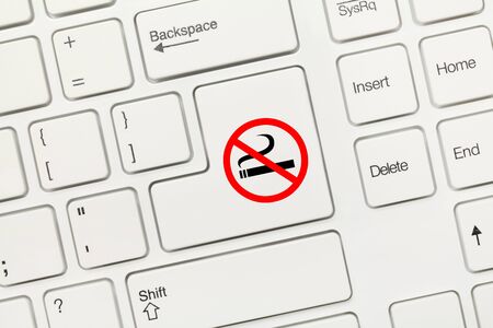 Close-up view on white conceptual keyboard - No smoking symbolの写真素材
