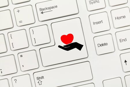 Close-up view on white conceptual keyboard - Healthcare symbolの写真素材