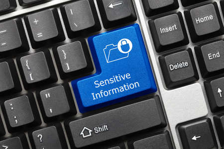 Close-up view on conceptual keyboard - Sensitive Information (blue key with folder and lock symbol)の写真素材