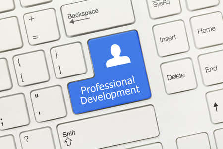 Close-up view on white conceptual keyboard - Professional Development (blue key)の写真素材