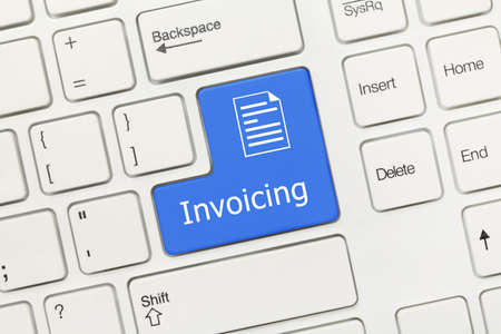 Close-up view on white conceptual keyboard - Invoicing (blue key)の写真素材