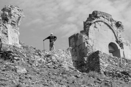 the worker works as a special tool for the restoration of the ruins of the ancient fortressの写真素材