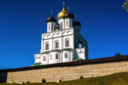Walk along walls of the Pskov Kremlin in summer sunny day