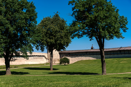 Walk along walls of the Pskov Kremlin in summer sunny dayのeditorial素材