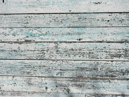 Old wooden background from the remains of paint and traces of useの写真素材